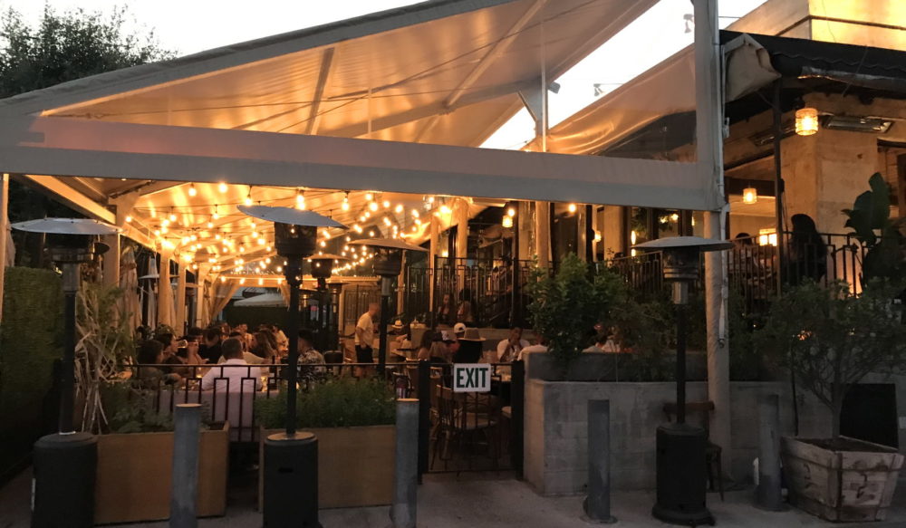 Outdoor dining at DAMA Fashion District Restaurant & Bar